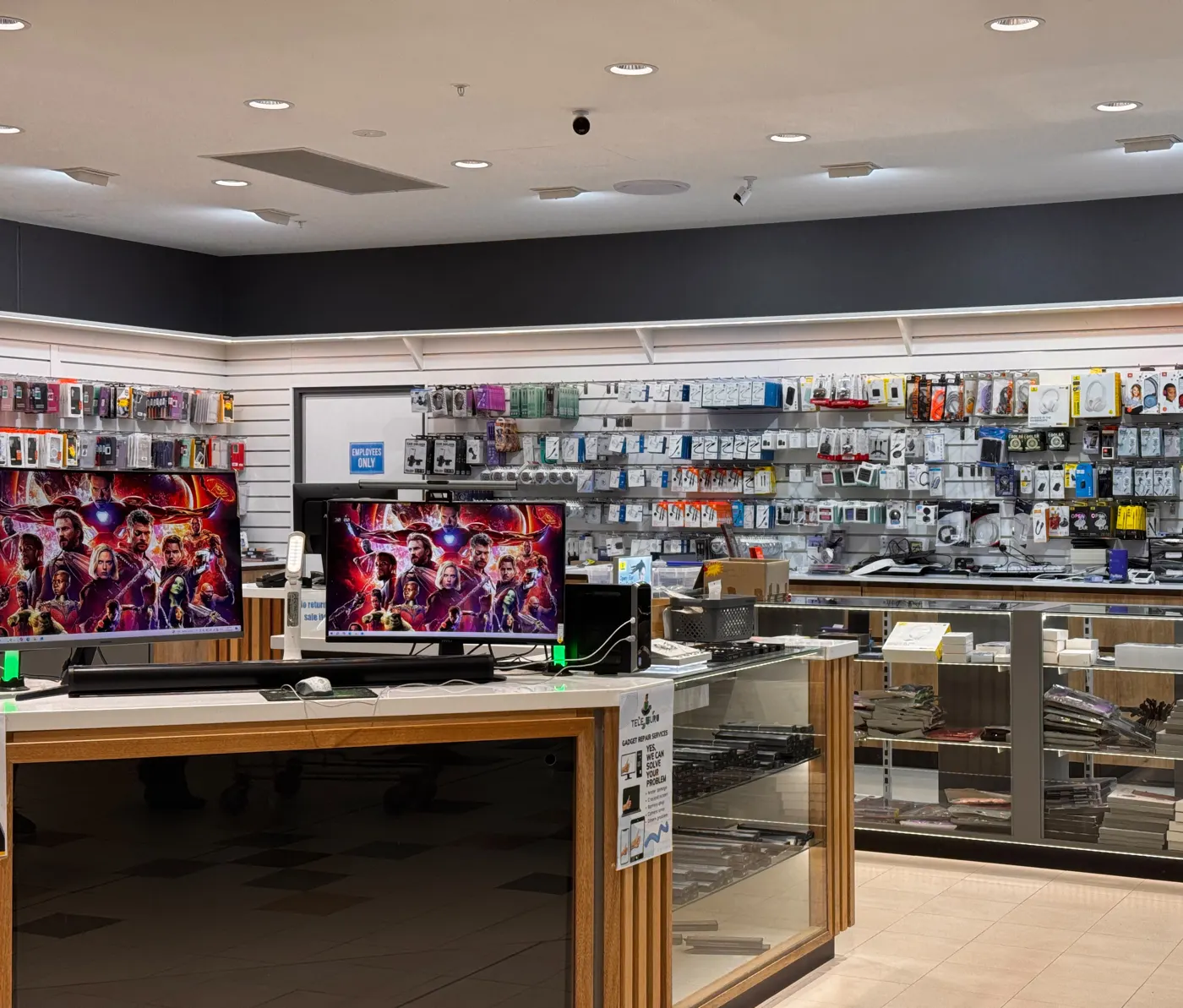 Inside a TELE GURU store with gaming monitors and accessories